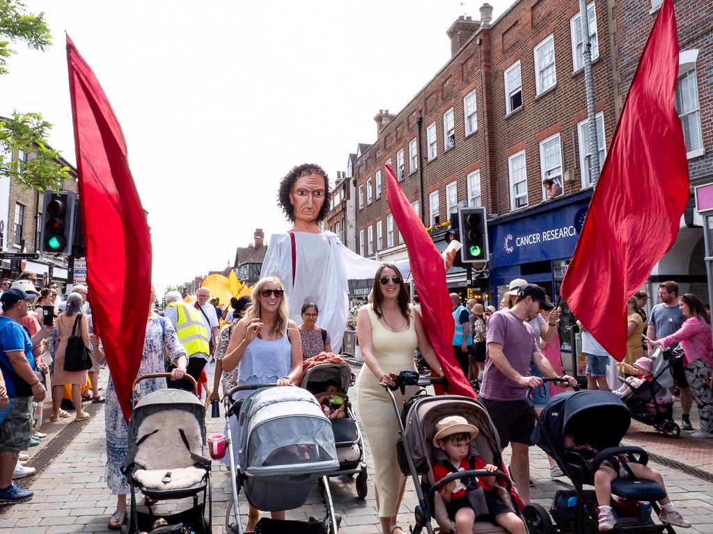 Pushchairs in the procession ahead of the judge puppet